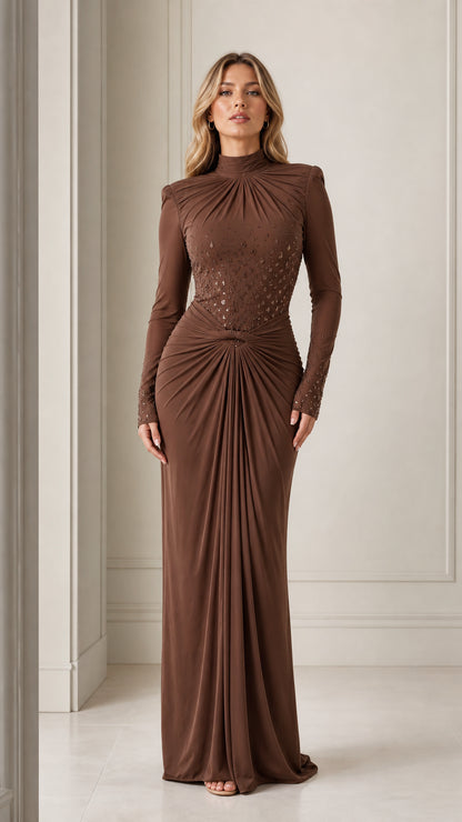 Front view of model wearing a brown long-sleeve mock neck draped maxi dress with sequin embellishments