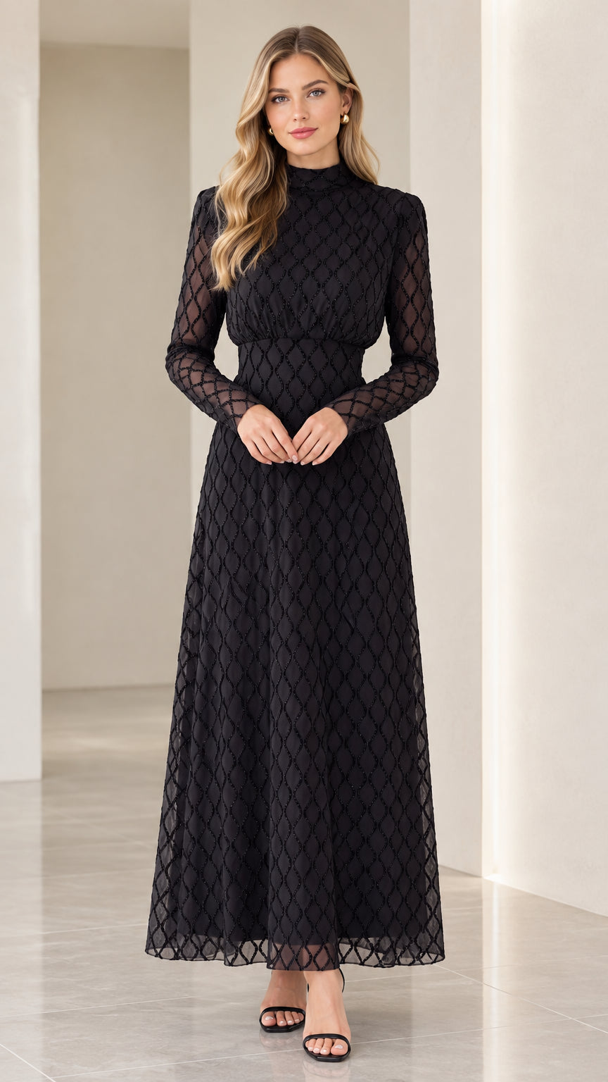 Front full view of woman wearing high neck black geometric long sleeve maxi dress