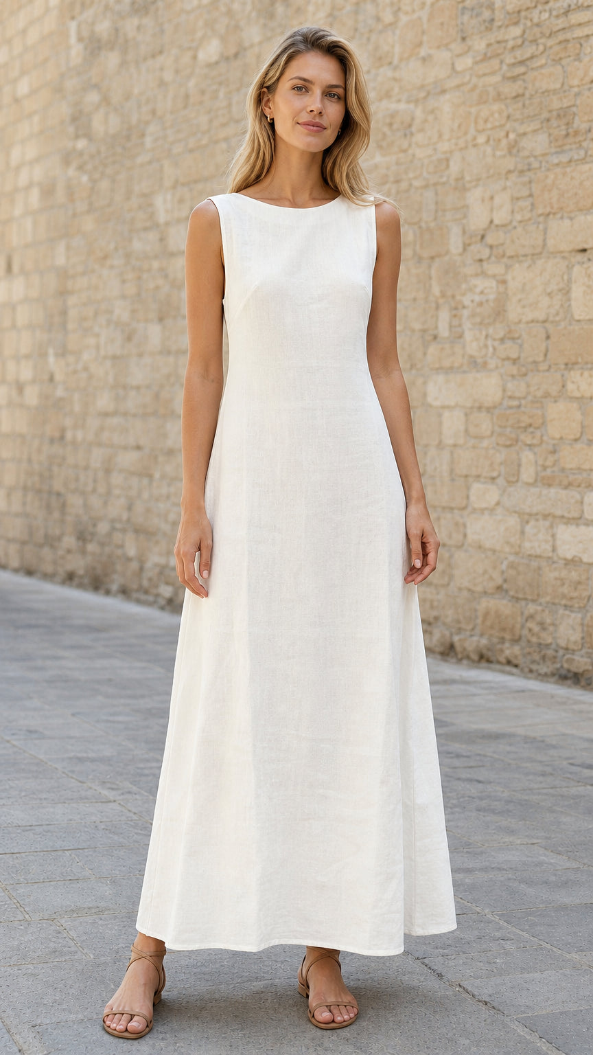 Front view of woman wearing white sleeveless maxi dress