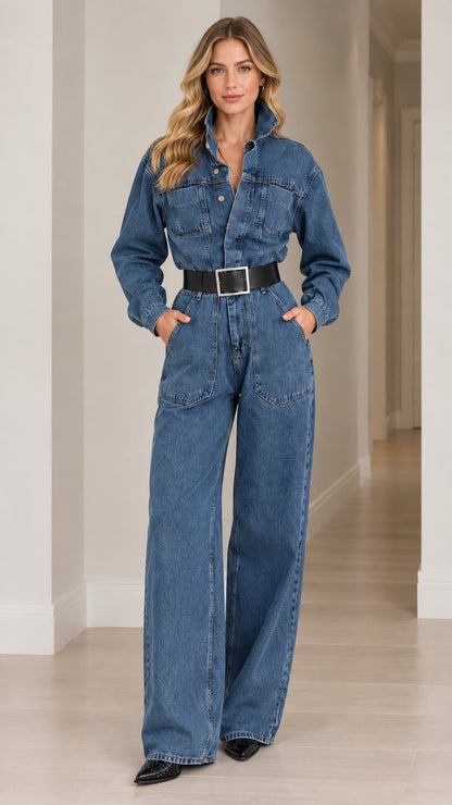 Front full-length view of woman wearing medium blue long sleeve wide leg denim jumpsuit with black belt