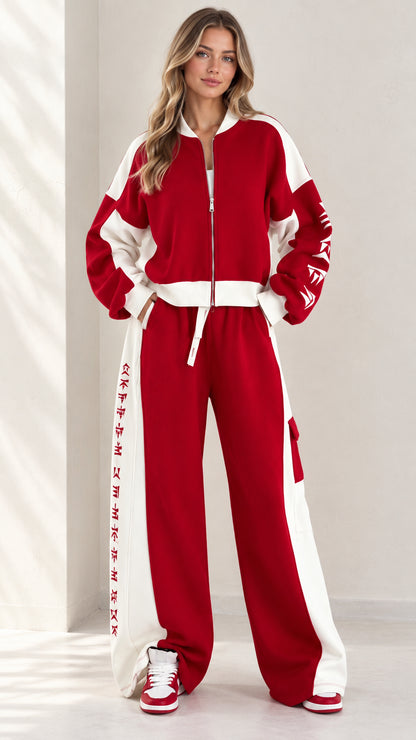 Full front view of model wearing women's red and white colorblock zip-up tracksuit set with wide leg pants