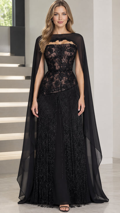 Front view of black strapless beaded evening gown with sheer cape overlay