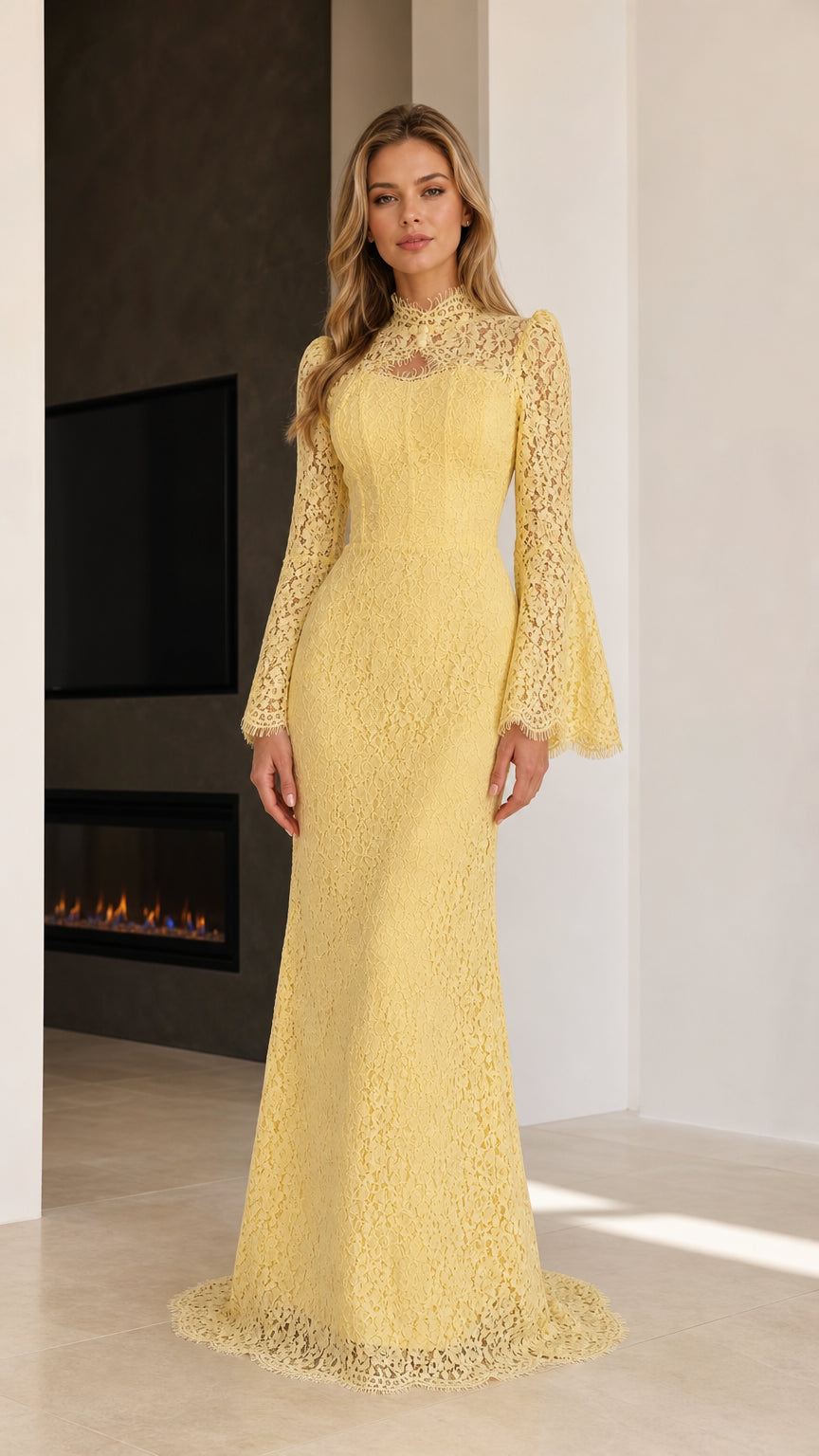 Front view of model wearing floor-length yellow floral lace gown with bell sleeves