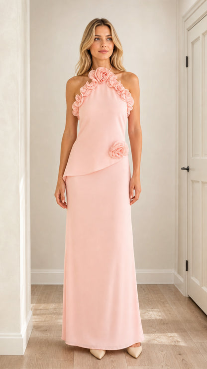 Front view of model wearing pink 3D floral halter maxi dress