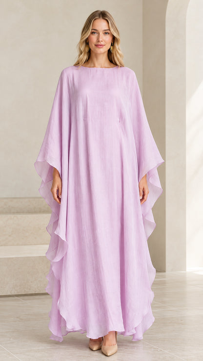 Full front view of model wearing lilac cascading ruffle kaftan maxi dress