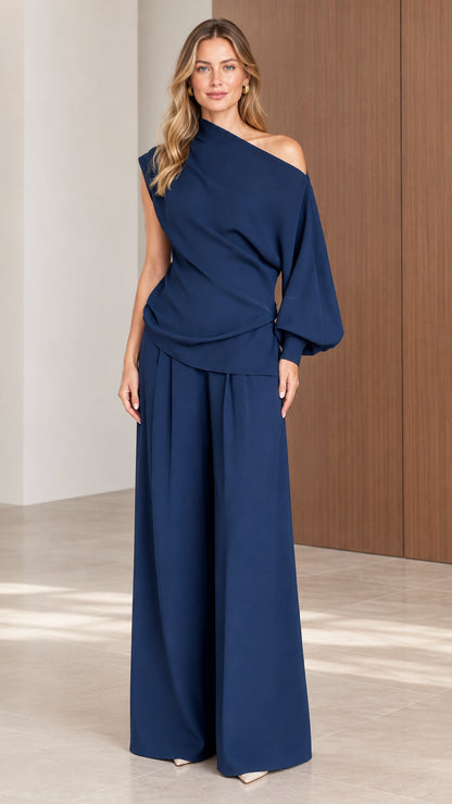 Front view of model wearing Navy Blue asymmetrical one-shoulder top and wide-leg pant set