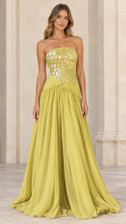 Front view of model wearing chartreuse strapless evening gown with embellished bodice