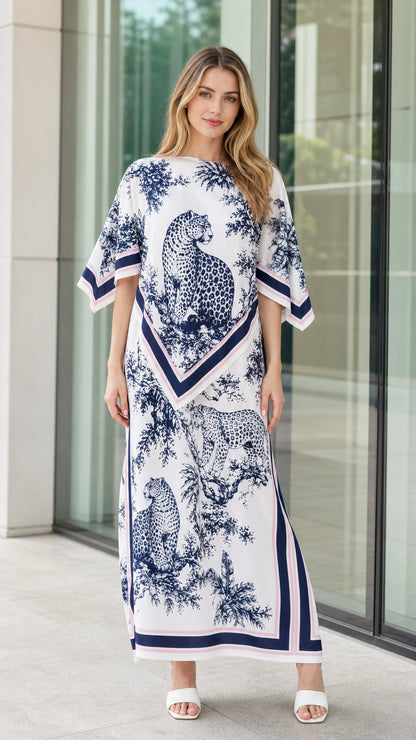 Front view of woman wearing white and navy leopard scarf print kaftan maxi dress