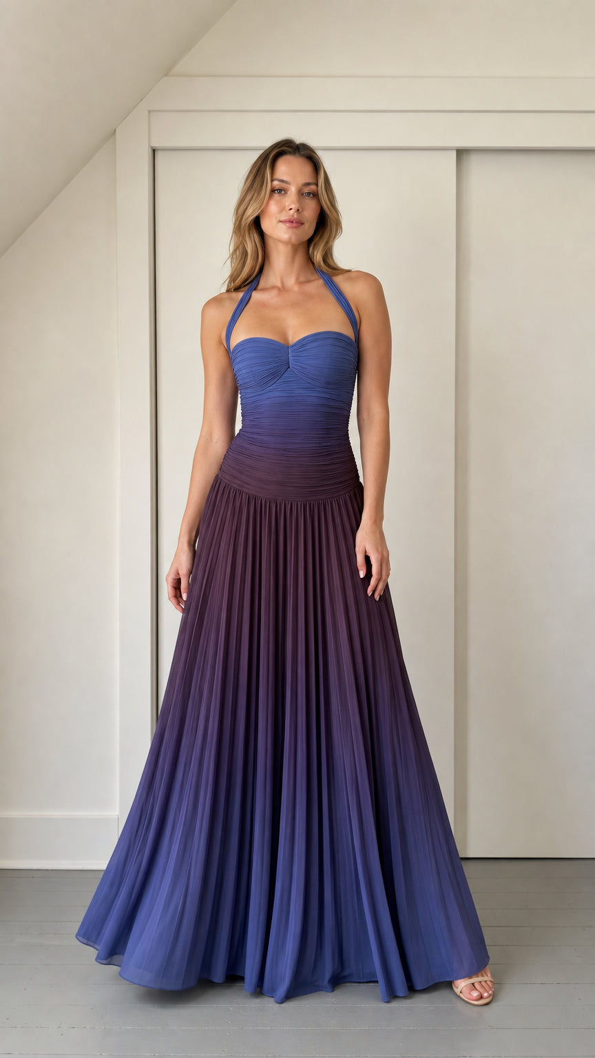 Front view of model wearing blue ombre ruched halter maxi dress