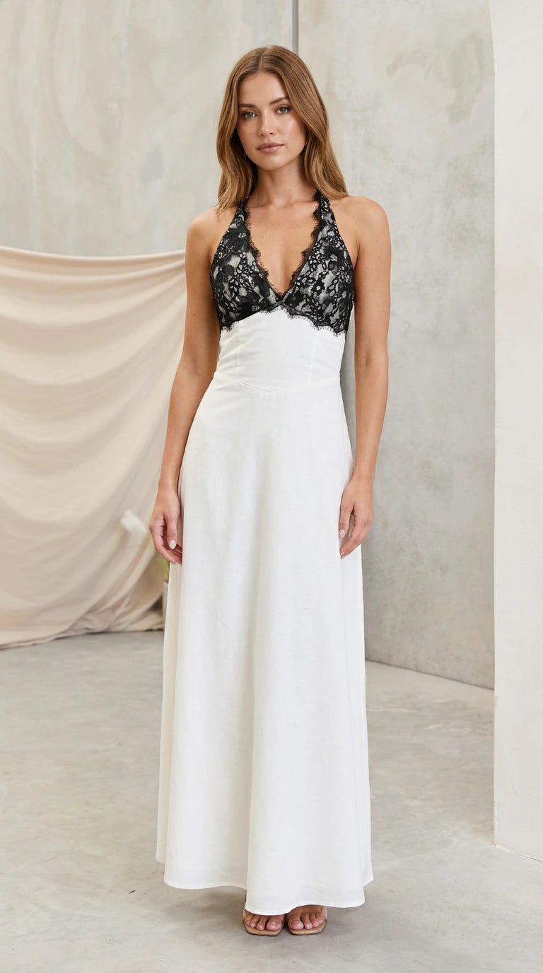 Model wearing white halter maxi dress with black eyelash lace bodice front view