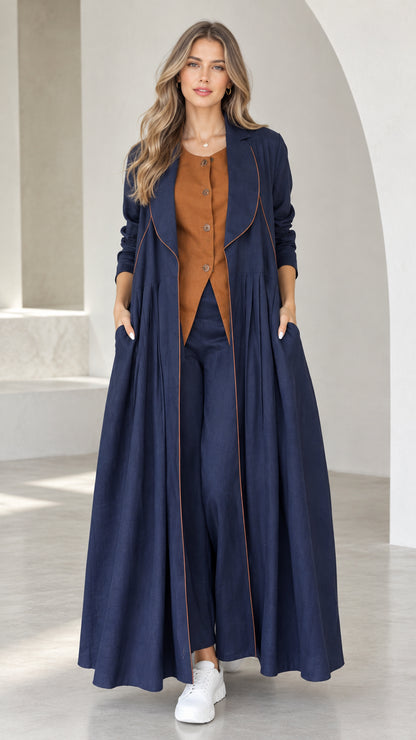 Front view of model wearing Navy Blue pleated maxi duster coat