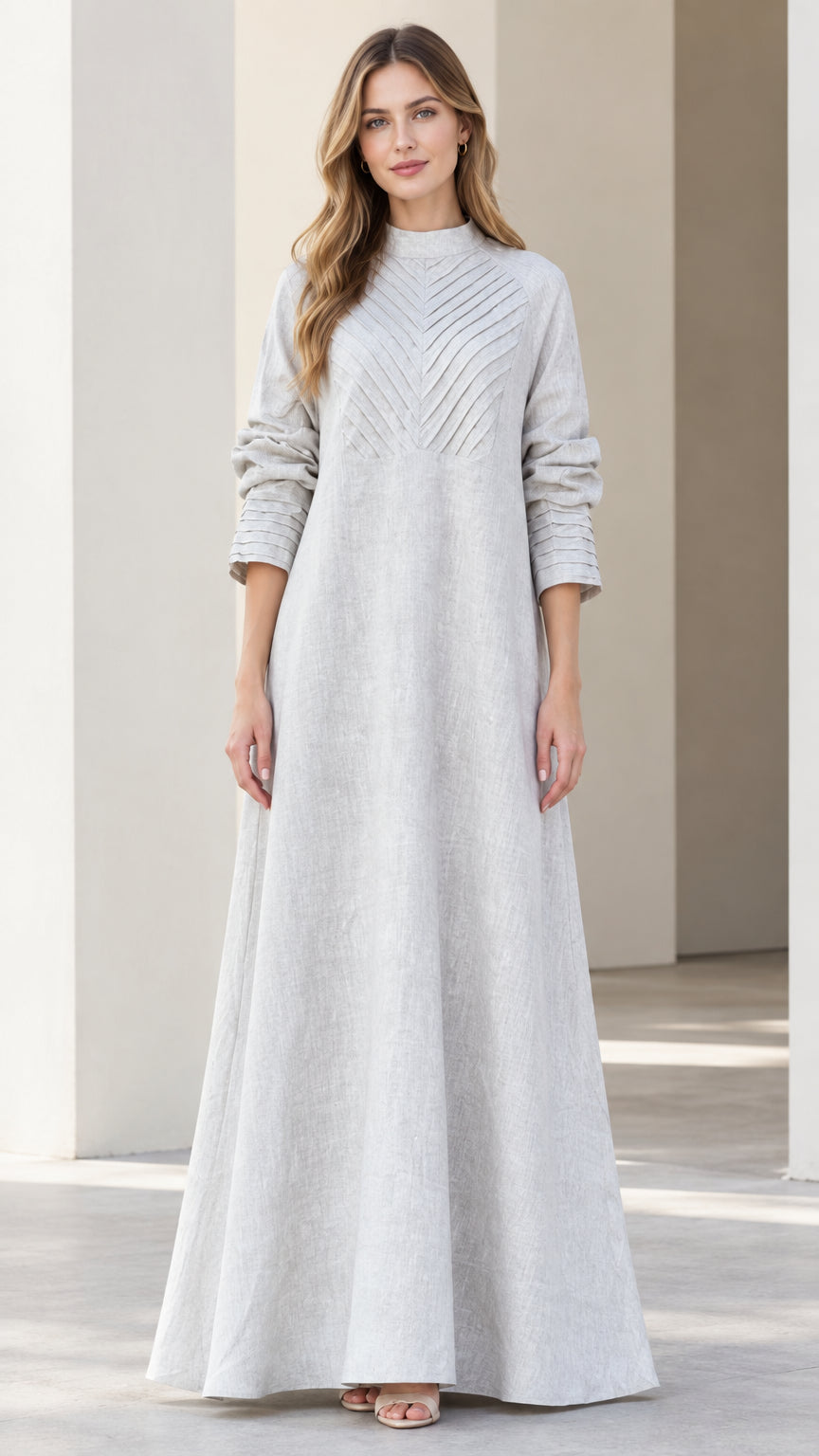 Front full view of light grey mock neck maxi dress with chevron pleated bodice