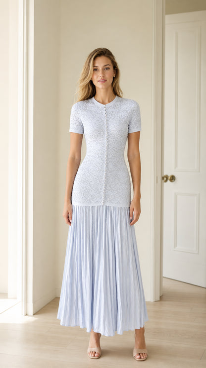 Front view of light blue pearl button knit bodice pleated midi dress