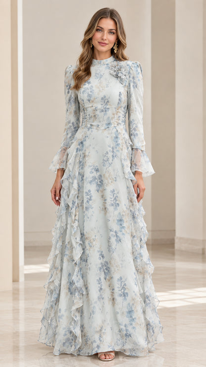 Front view of woman wearing dusty blue floral mock neck maxi dress with 3D flower applique