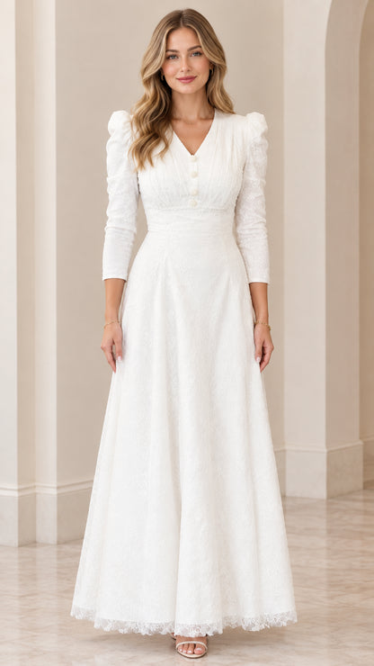 Front view of woman wearing elegant white lace maxi dress with V-neckline and 3/4 sleeves