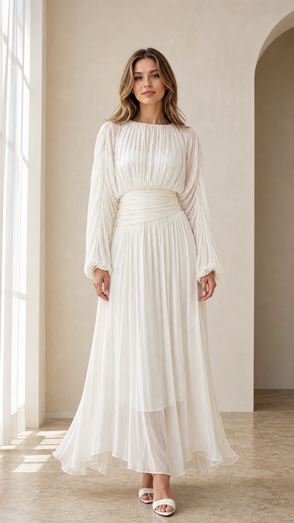 Front view of model wearing white long sleeve pleated maxi dress