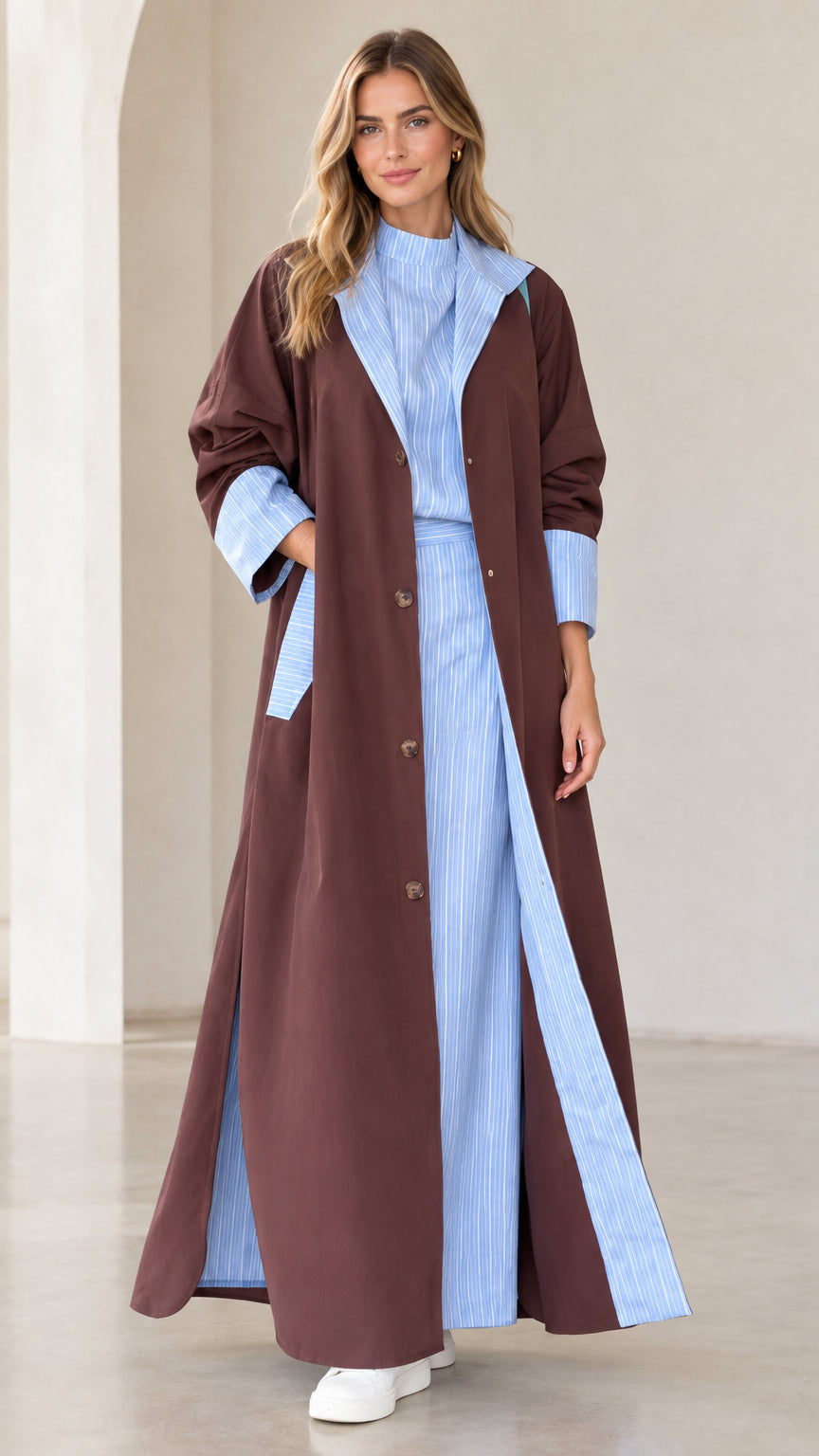 Full front view of women's brown longline duster coat with light blue pinstripe contrast lapels