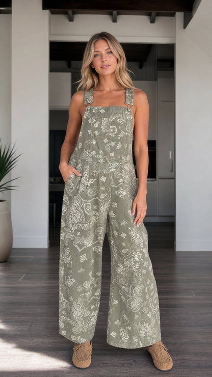 Front view of woman wearing Sage Green paisley print wide-leg bib overalls
