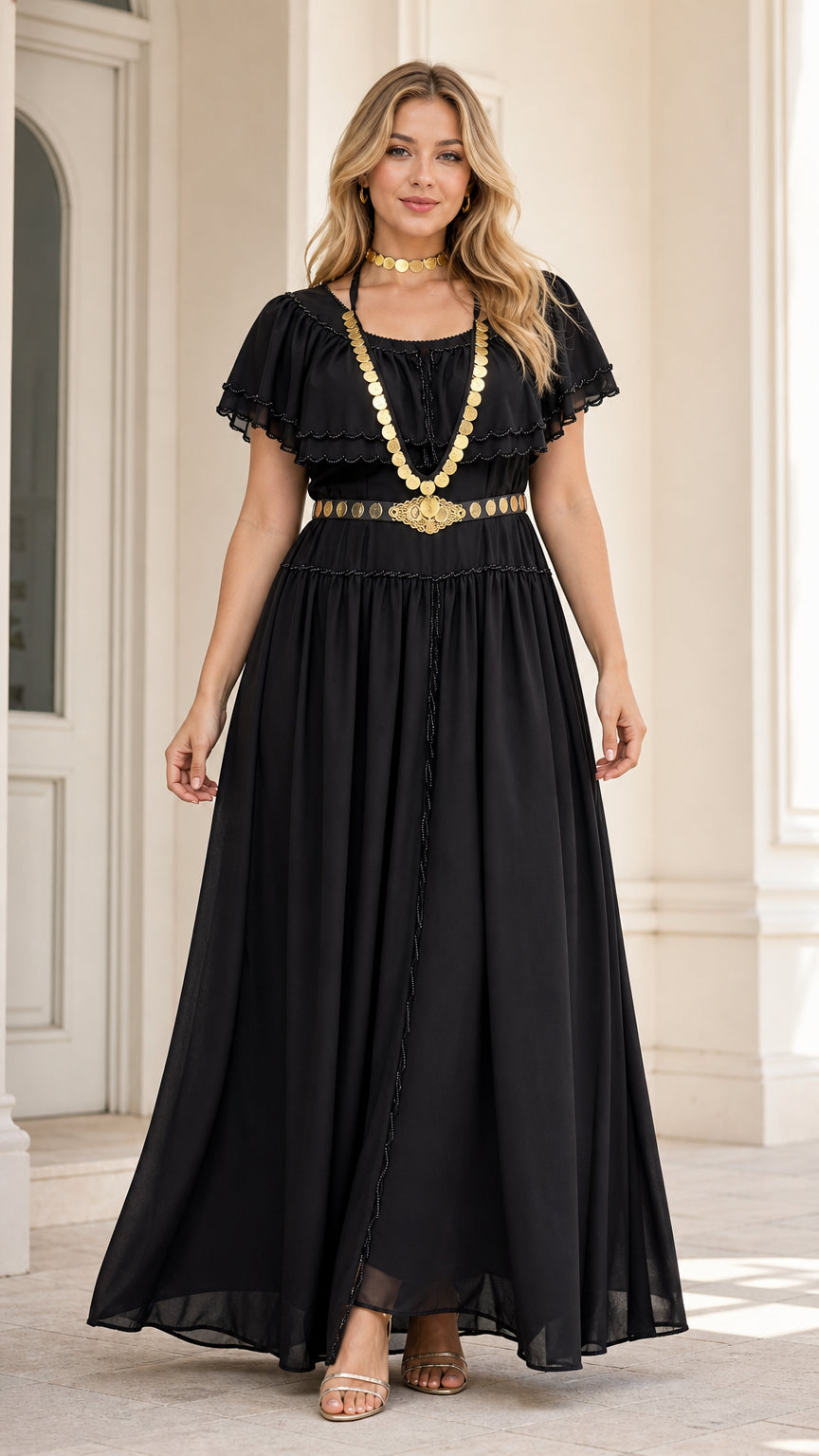 Front view of model wearing black tiered ruffle maxi dress styled with gold waist chain