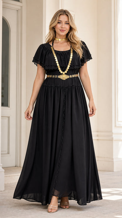 Front view of model wearing black tiered ruffle maxi dress styled with gold waist chain