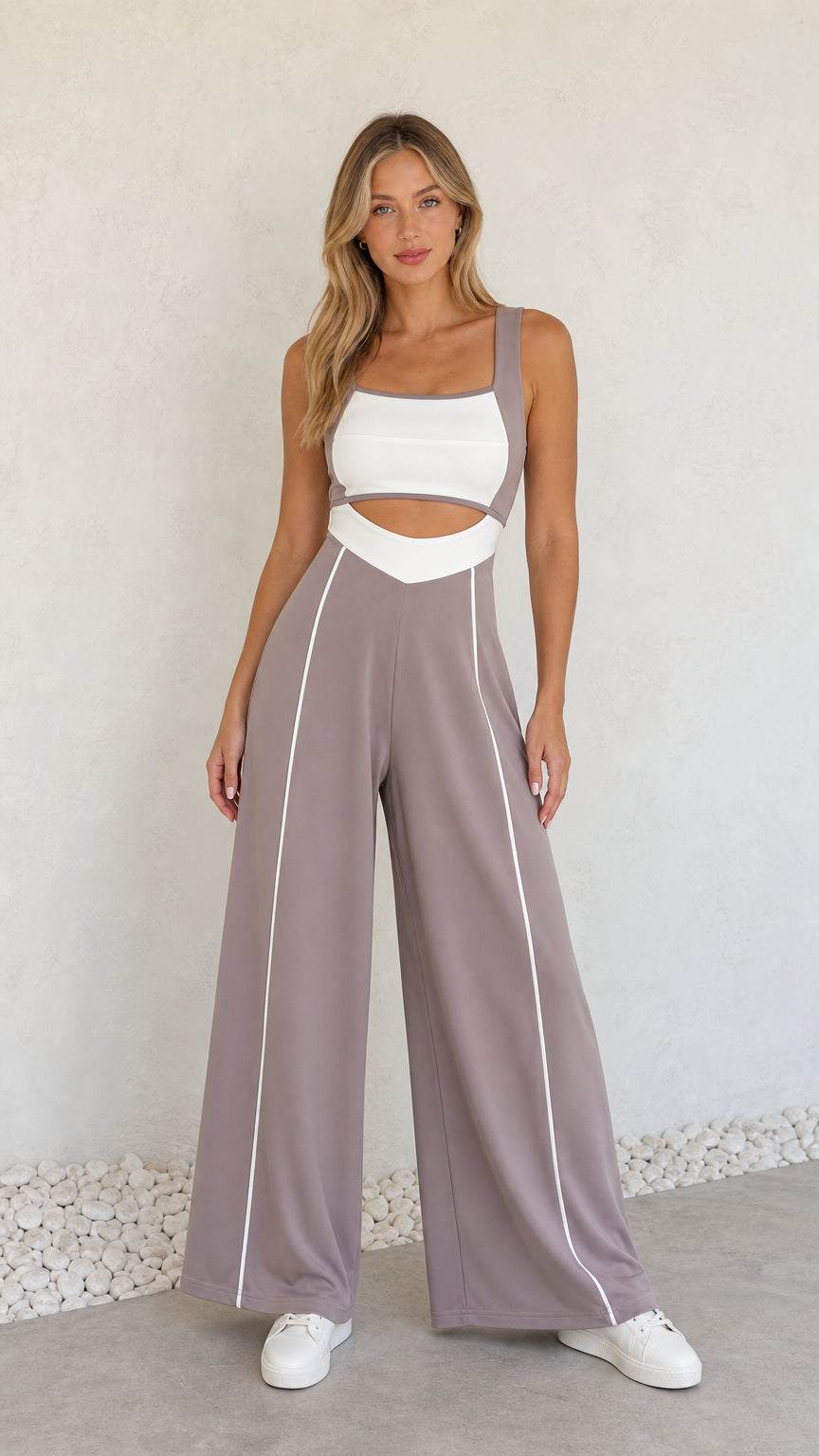 Full front view of model wearing dusty mauve colorblock cutout wide-leg jumpsuit