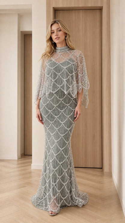 Front view of model wearing sage green pearl-embellished capelet evening gown