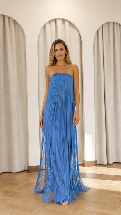 Front view of model wearing blue strapless fringe maxi dress