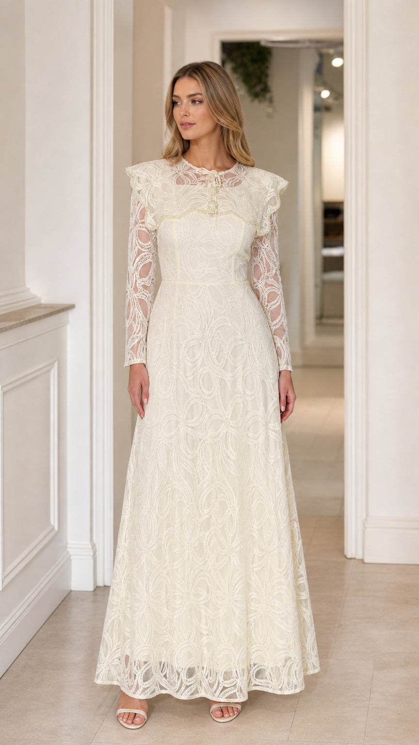Front full-length view of the Ivory Lace Capelet Maxi Dress