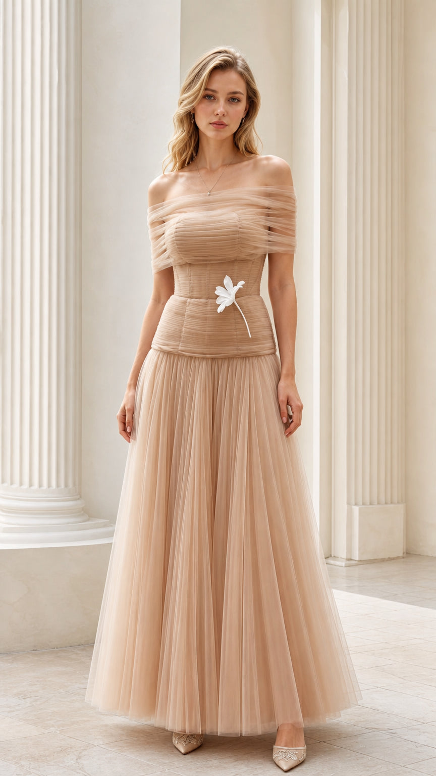 Model wearing champagne off-the-shoulder tulle corset maxi gown front view