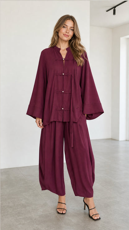 Front full view of women's burgundy Zen style tunic top and matching lantern pants set