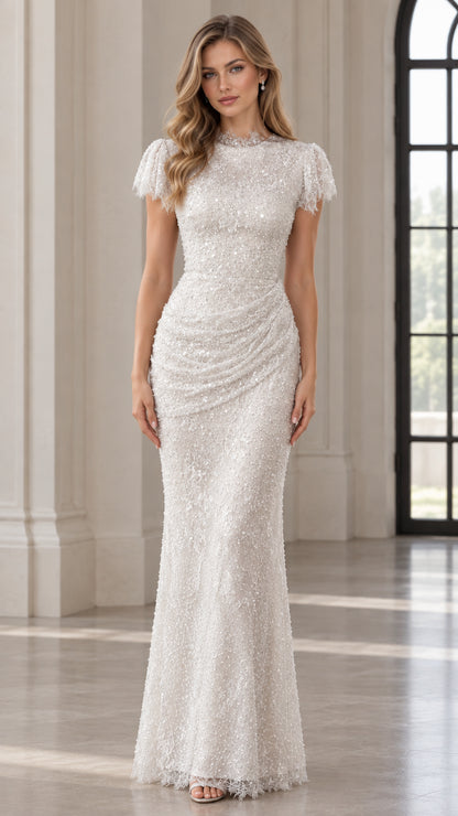 Front view of model wearing a white sequin mock neck floor-length evening gown with cap sleeves