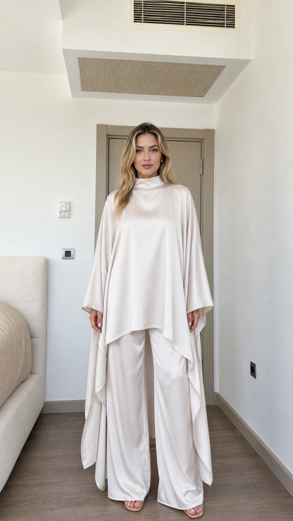 Front full view of woman wearing Cream satin high neck cape tunic and wide-leg pant set
