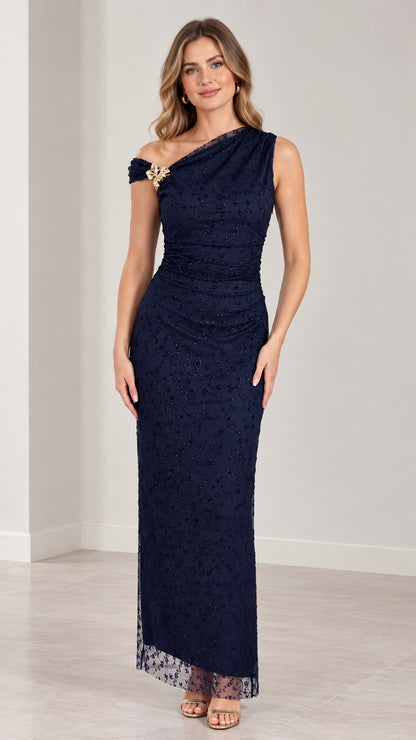 Full-length front view of navy blue one-shoulder beaded column evening gown with brooch
