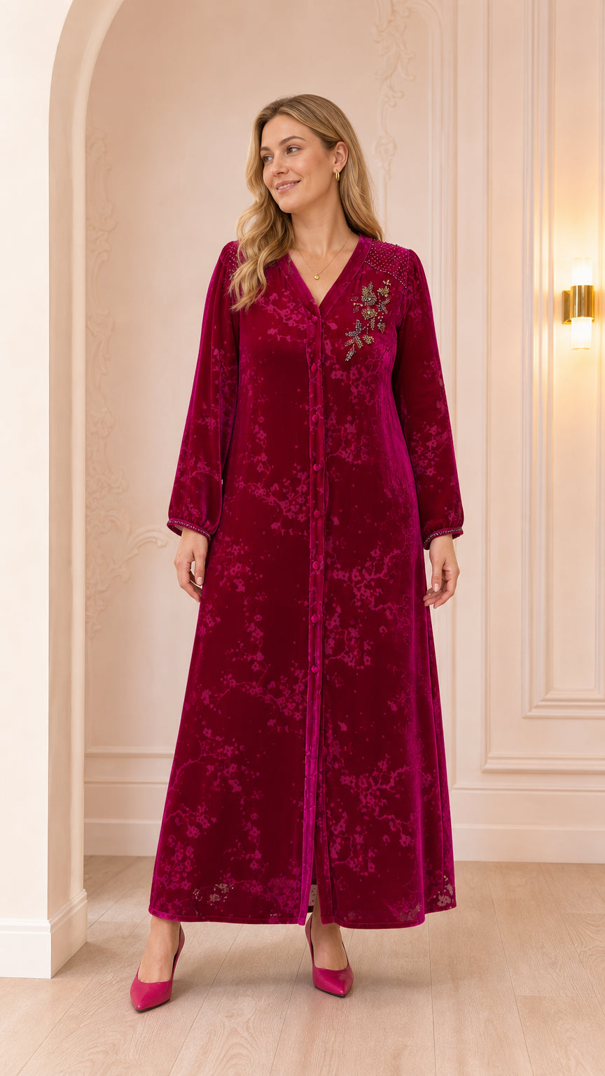 Full front view of woman wearing magenta floral beaded velvet maxi dress