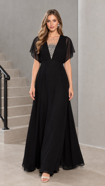 Front view of model wearing black flutter sleeve chiffon evening maxi dress with rhinestone illusion neckline