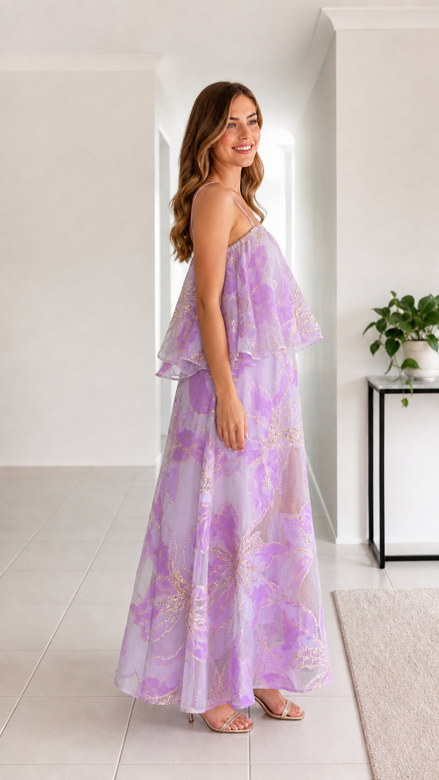 Side profile of woman in lavender tiered floral organza maxi dress