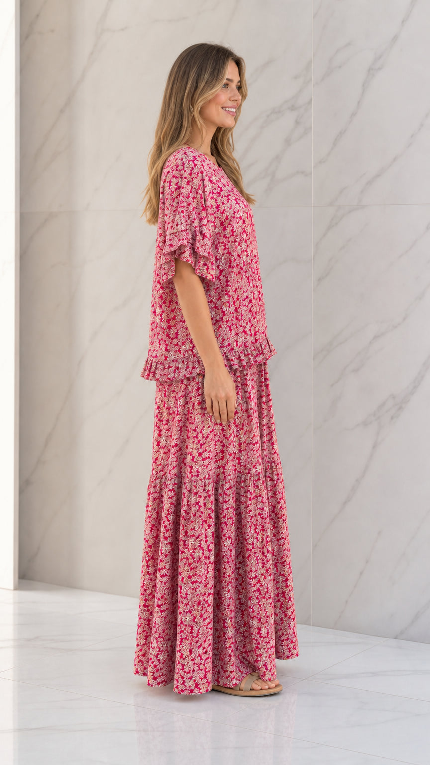 Side full view of woman wearing Rose Pink floral matching two-piece set