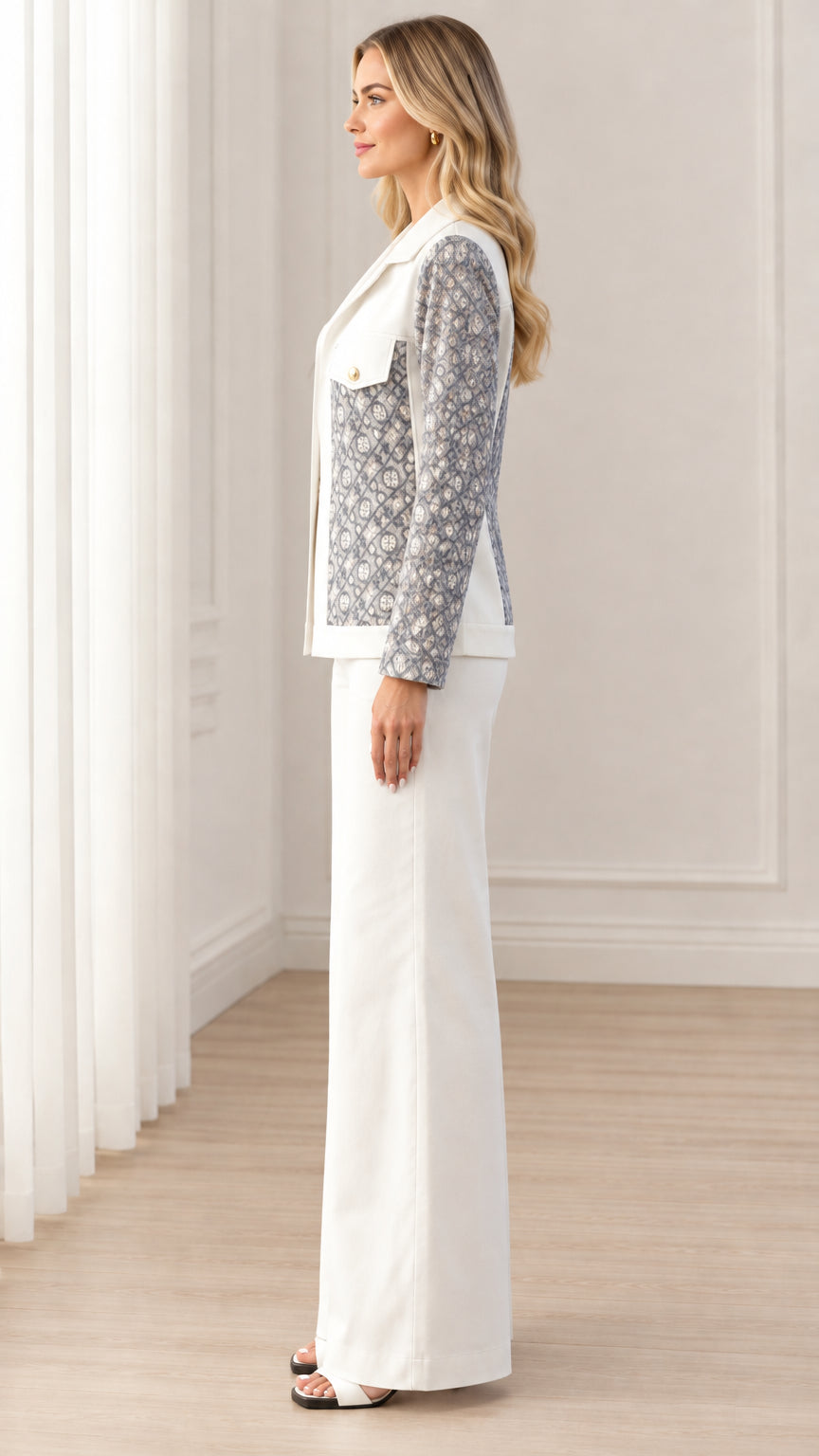 Side profile view of women's white contrast jacket and tailored wide-leg pants