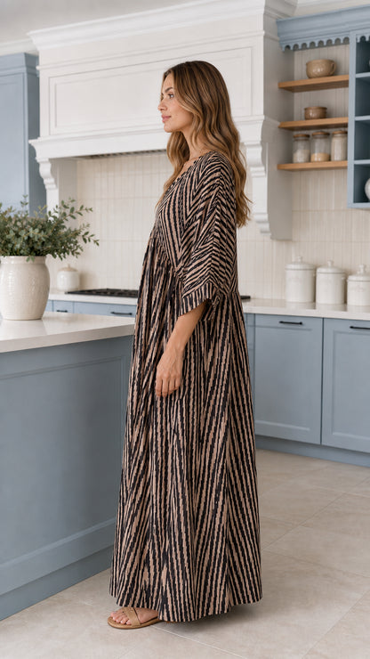 Side profile view of Mocha Brown flowing wide-leg jumpsuit with kimono sleeves