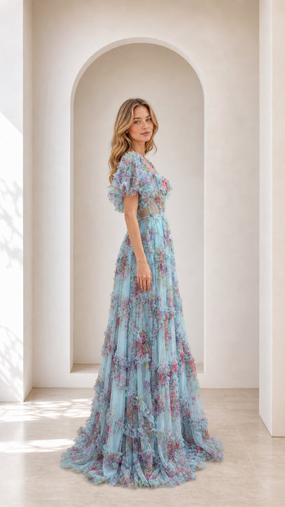 Side profile view of light blue floral tulle ball gown with puff sleeves