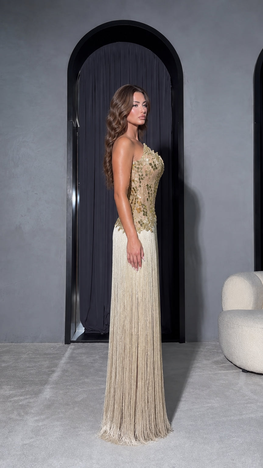 Side full-length view of Champagne Gold strapless fringe evening gown