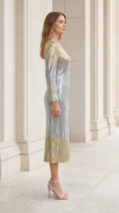 Side profile view of woman modeling silver and gold sequin midi evening dress