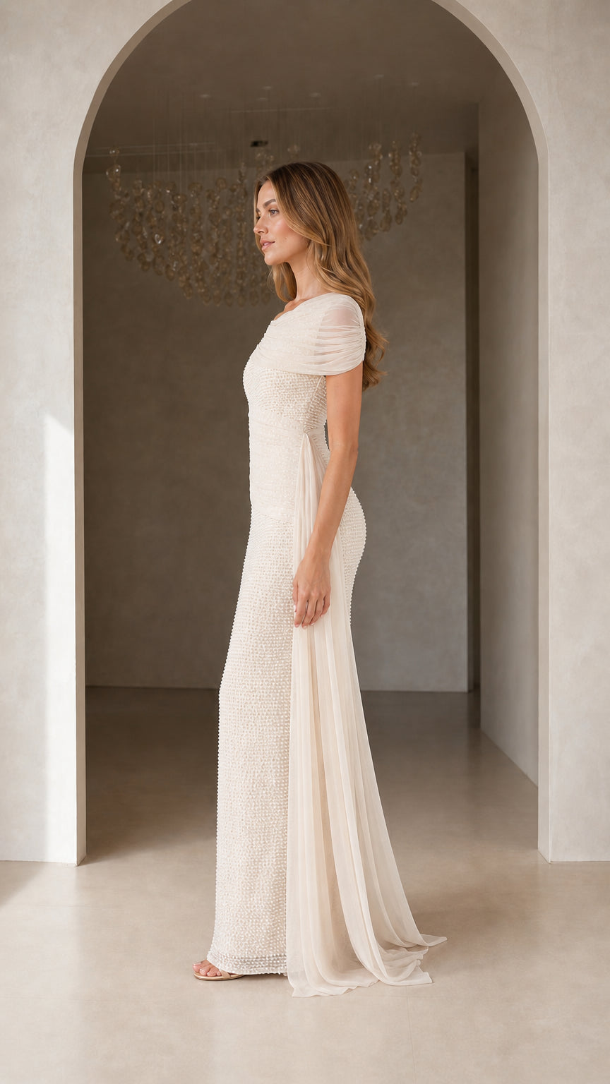 Side view of Champagne formal maxi dress with cascading drape