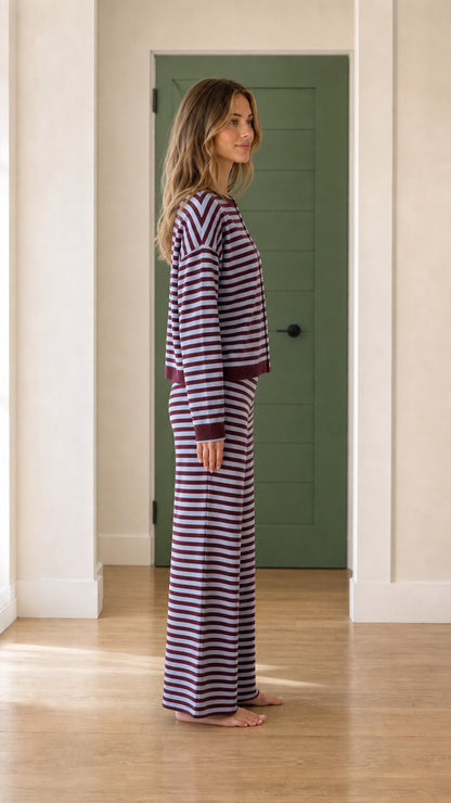 Side profile of model wearing purple striped loungewear set