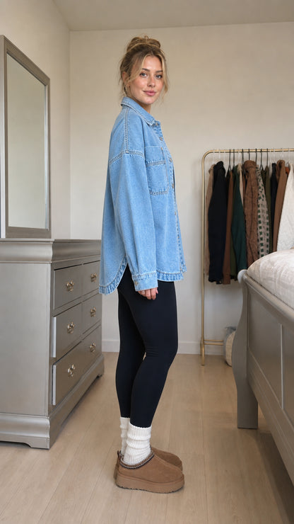 Side profile view of model in light blue denim shacket