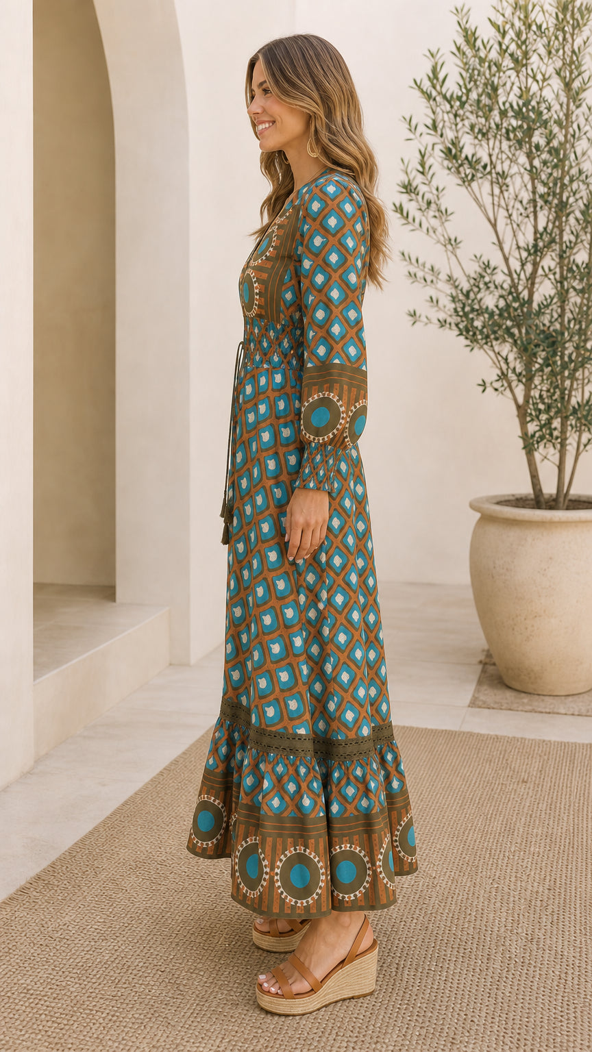 Side profile of model wearing Teal Brown tiered geometric smocked waist maxi dress