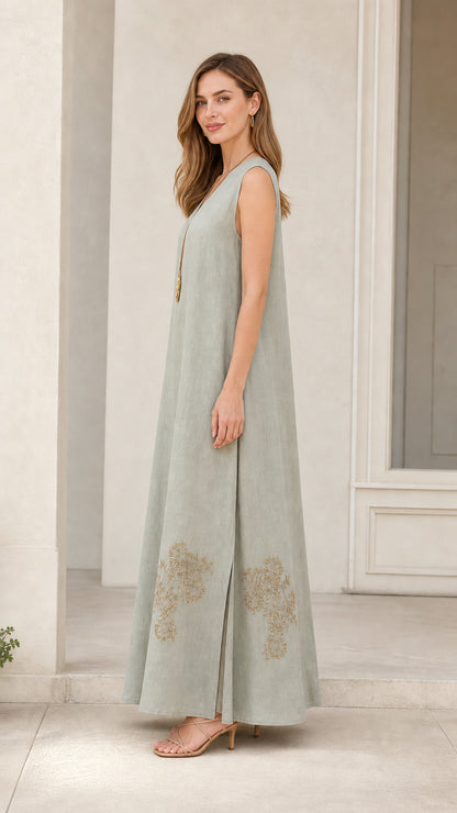 Side profile of model in sage green embroidered maxi dress
