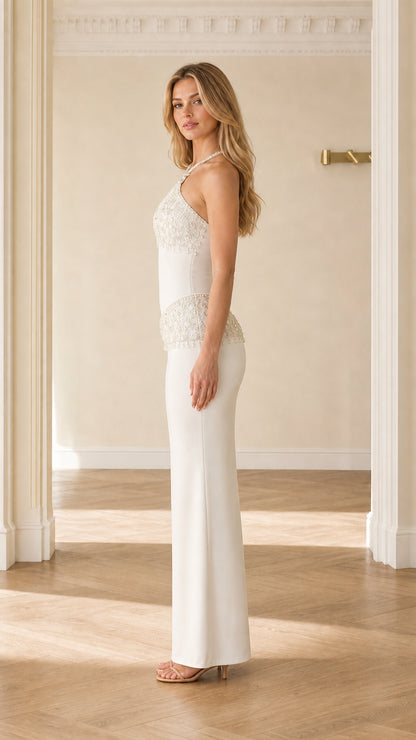 Side full-length view of white halter formal dress with beaded basque waist