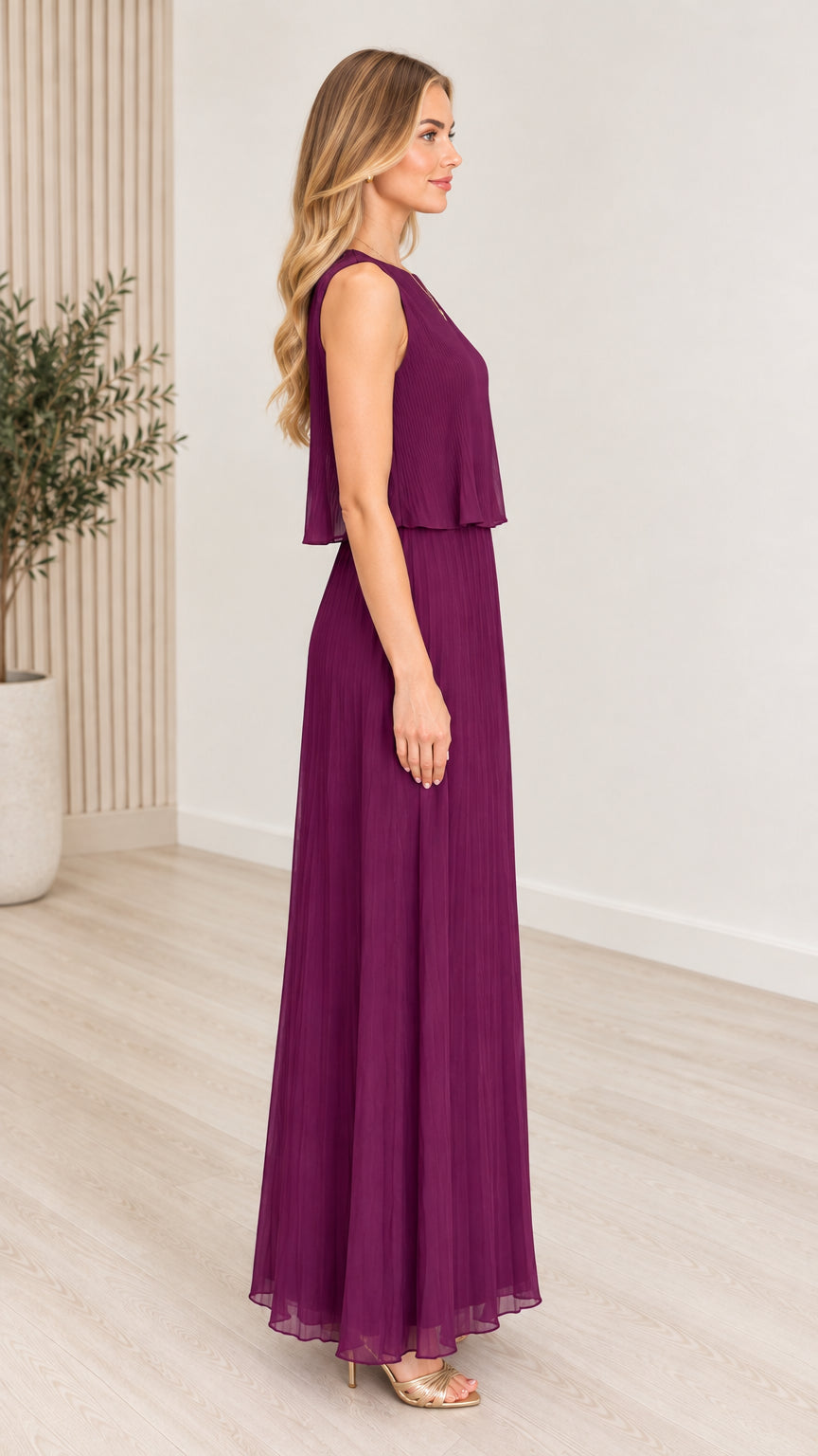 Side profile of model wearing plum pleated layered maxi dress
