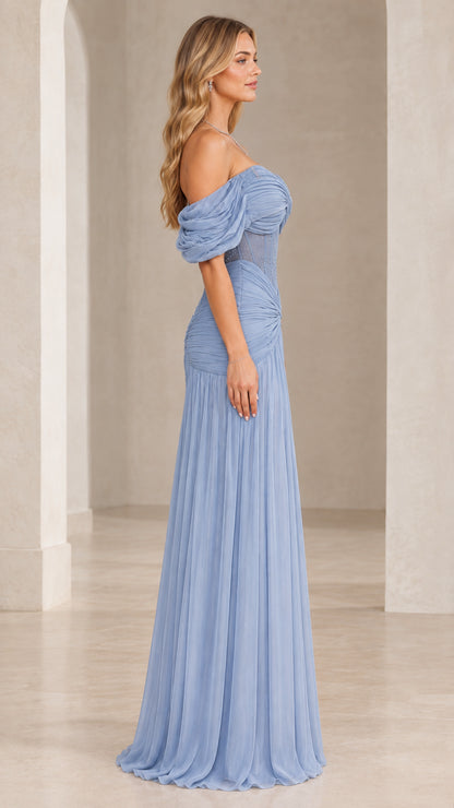 Side profile view of woman modeling Dusty Blue draped chiffon formal dress